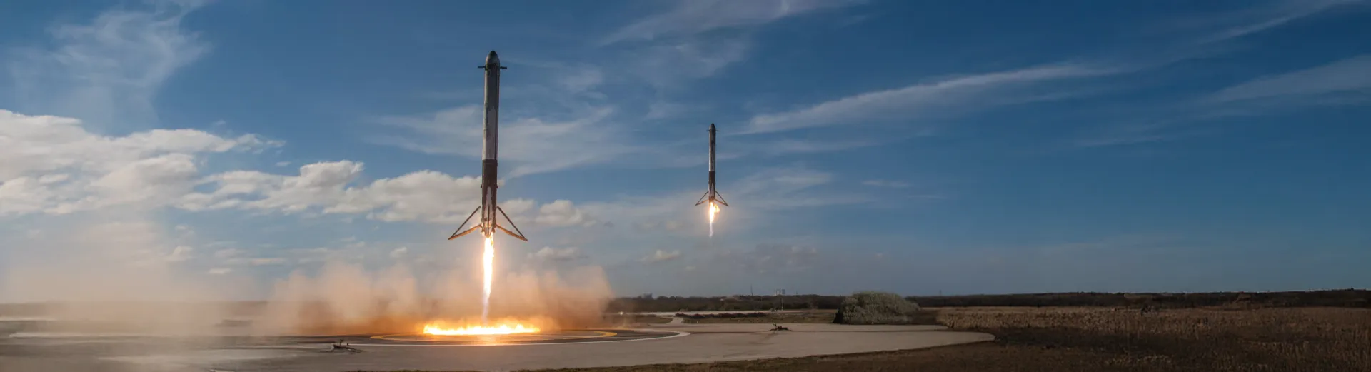 SpaceX Falcon Heavy booster rockets landing simultaneously, representing precision, scale, and the power of a coordinated digital marketing strategy